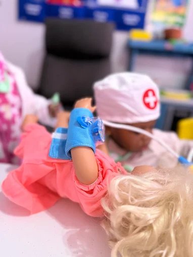 Child playing with kitchen toys